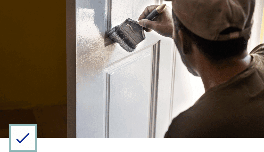Man Painting a Door